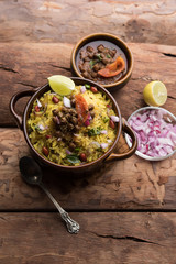 Aloo/Kanda Poha or Tarri Pohe with spicy chana masala/curry. selective focus
