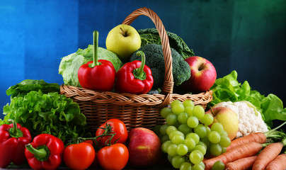 Fresh organic fruits and vegetables in wicker basket