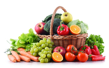 Fresh organic fruits and vegetables in wicker basket - obrazy, fototapety, plakaty