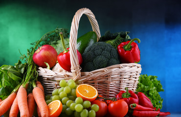 Fresh organic fruits and vegetables in wicker basket