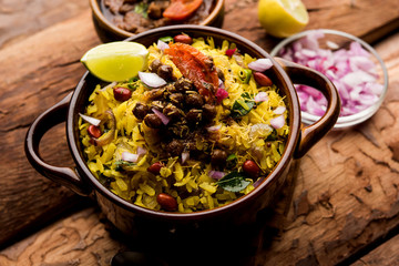Aloo/Kanda Poha or Tarri Pohe with spicy chana masala/curry. selective focus