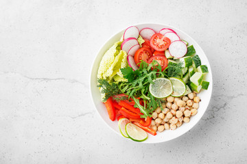 Healthy vegetarian salad.  Chickpea, radish, tomatoes, cucumber, lettuce,pepper and green onion.
