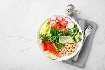 Healthy vegetarian salad.  Chickpea, radish, tomatoes, cucumber, lettuce,pepper and green onion.