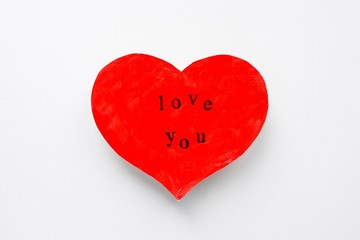 Valentine's day postcard in the form of a scarlet heart with the inscription love you
