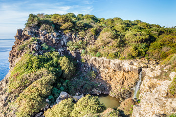 Waterfall near Capo Nieddu near Bosa at the Northern East  coast of Sardinia, in Italy