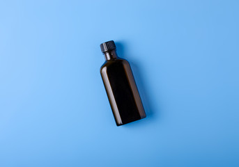throat cough syrup medicine health on blue background top view