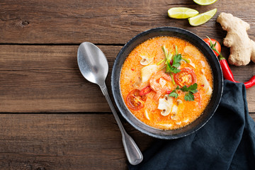 Thai food soup Tom Yam with Coconut milk, Chili pepper and Seafood.