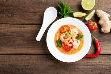 Thai food soup Tom Yam with Coconut milk, Chili pepper and Seafood.