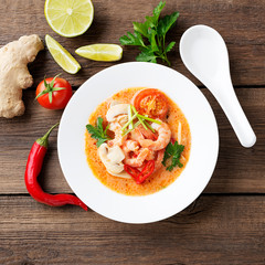 Thai food soup Tom Yam with Coconut milk, Chili pepper and Seafood.