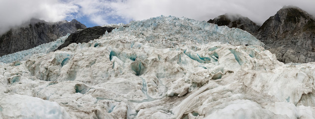 Franz Josef Glacier crampons hike through the blue glacier ice - New Zealand, South Island, NZ