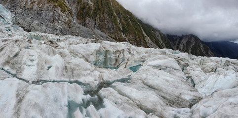 Obraz na płótnie Canvas Franz Josef Glacier crampons hike through the blue glacier ice - New Zealand, South Island, NZ