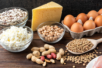 Food rich of protein.Healthy eating and diet concept. Eggs, cheese, cottage cheese, walnut, peanut, green lentil, beans and chick peas.