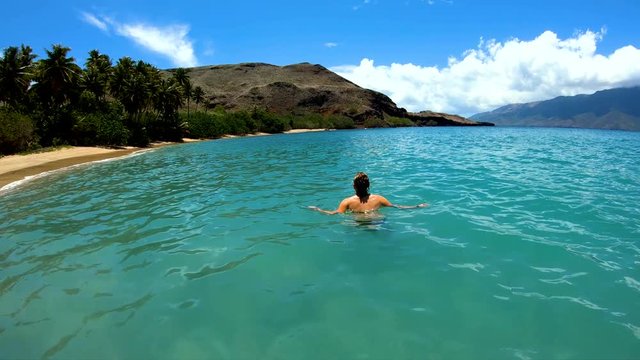 Female on a deserted Island beach Tahuata Marquesas