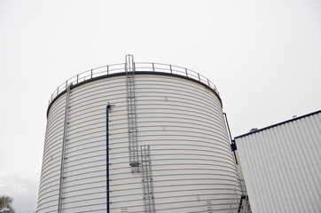 Biogas tank on a biogas plant. Wastes recycling ecology concept. Green economics. Copy space.