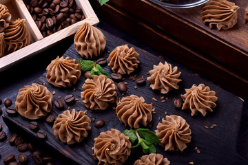 Coffee creamy fudge on a dark wooden board