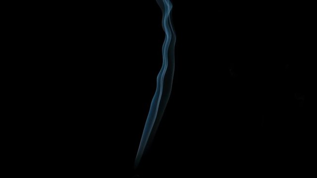 Graceful Bends of the Blue Smoke. Natural Colorful smoke rises up and spins into graceful spirals. Filmed at a speed of 240fps