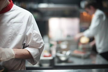 Restaurant Chef cook preparing sea food in open kitchen at restaurant.