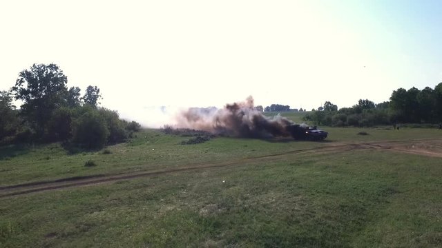 Top view burning German tank with black smoke. Shot from drone. Victory in war