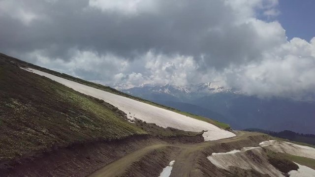Aerial shot of snake road high at roza khutor mountains
