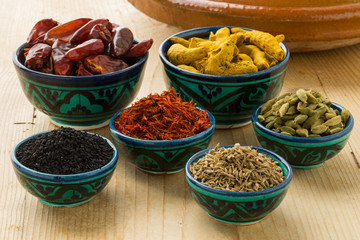  Moroccan dried herbs in traditional bowls