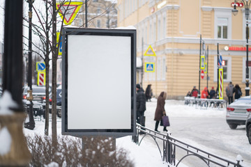 Vertical mock-up of city poster winter city with thick edges, blank white billboard in urban...