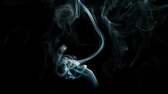 Magical Blue Smoke Stream. Natural Colorful smoke rises up and spins into graceful spirals. Filmed at a speed of 240fps