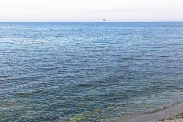 Obraz premium Colorful seascape. Natural sky gradient. Multicolored clouds over the calm sea. Turquoise and azure water color in the ocean. Small waves. Sea horizon. Cloudy sky.