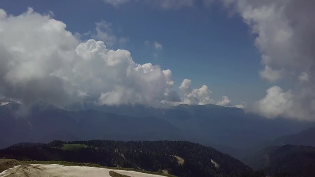 Panorama of beautiful mountain valley from the top of roza khutor mountains