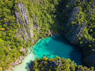 Fototapeta na wymiar Aerial view to tropical Twin lagoon with azure water, Coron island. Palawan, Philippines.