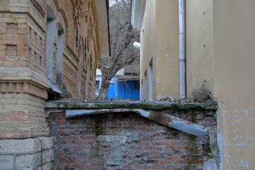 Backyard of a one-story old apartment building in a small town