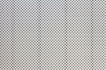 gray and black small polka dots pattern, abstract background with holes © Zarifa