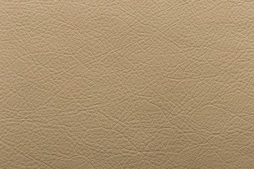 Artificial leatherwith mustard color with a pronounced embossed.	