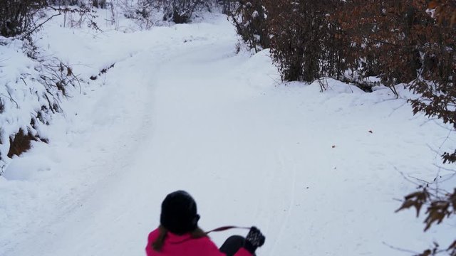 Children sledging on snow - (4K)