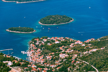 Aerial view of smaal town with harbor on the Adriatic coast in Croatia