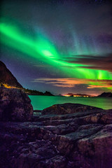 Fototapeta na wymiar Northern lights over Haukland Beach - Lofoten Islands, Norway