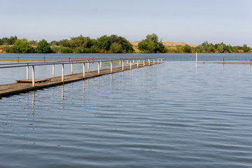 Fototapeta na wymiar A wooden pier on the lake.