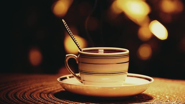 one hot tea cup spoon gold bokeh nobody hd footage 