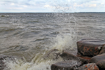 Blow waves with splashes of stones