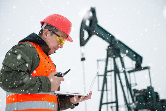 Oil Drill, Oil And Gas Field ,pump Jack,  Snow Storm And Worker.