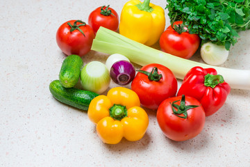 Composition with raw vegetables on table.