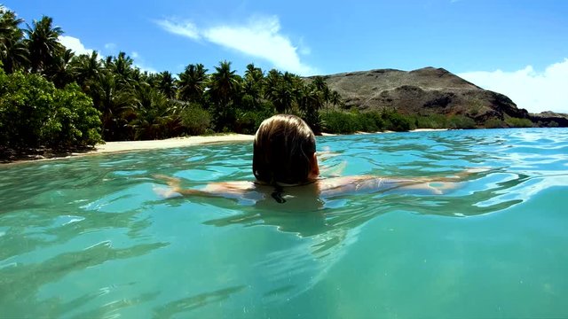Tahuata Marquesas young female on deserted ocean beach