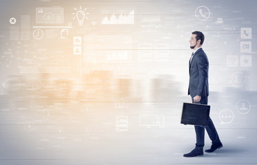 Handsome businessman walking in suit with briefcase on his hand and database concept around

