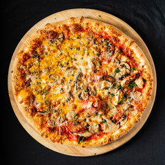 pizza on the black background