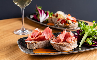 Sandwich with prosciutto, cheese and lettuce