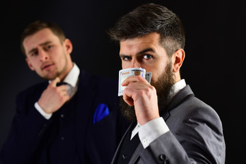 Money has no smell. Bearded man with cash money. Successful coworkers or colleagues. Business...