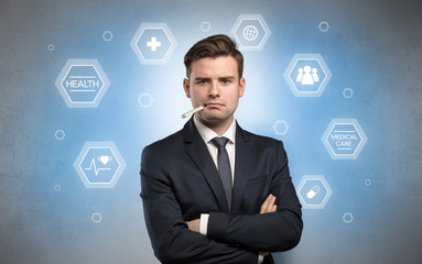 Young businessman with medical care, pills concept
