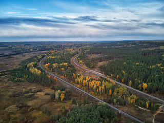 Russian sparsely populated village. Green meadows and dense shrubs. View from above.