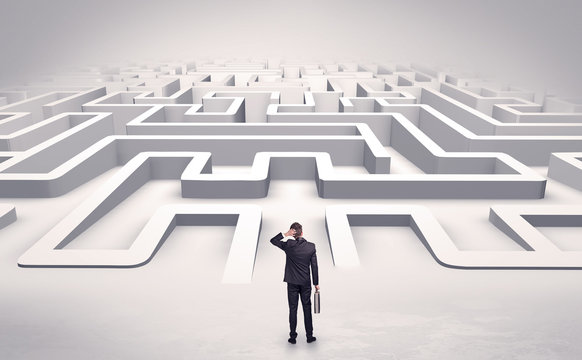 Businessman getting ready to enter a 3D flat labyrinth concept
