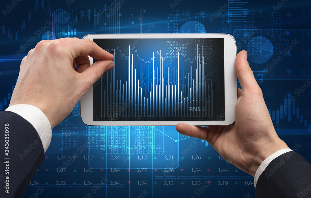 Wall mural first person hand using tablet and checking financial report on cloud computing system