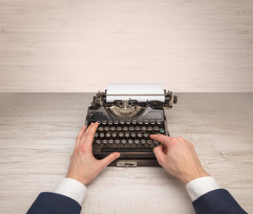 First person perspective elegant hand writing on an oldschool typewriter with copyspace
